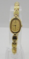 SEIKO 2E20-5739 GOLD TONE GOLD DIAL QUARTZ 13MM WRIST WATCH