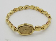 SEIKO 2E20-5739 GOLD TONE GOLD DIAL QUARTZ 13MM WRIST WATCH