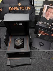 LIV GX1 Signature Orange On A Black Silicone With Orange Accents Strap
