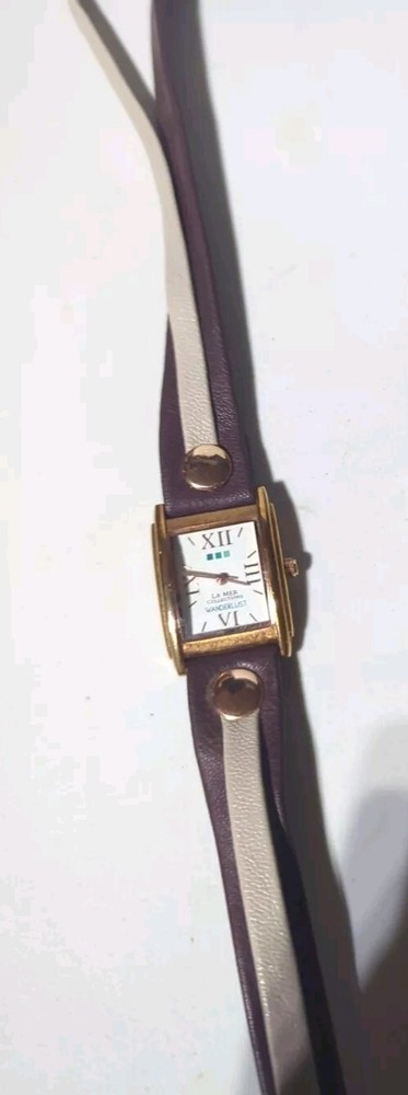 Wanderlust by La Mer Collections White Dial Gold Tone Case Brown Wrap Band Watch