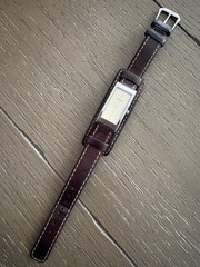 womens vintage fossil watch with silver rectangular face and brown leather strap
